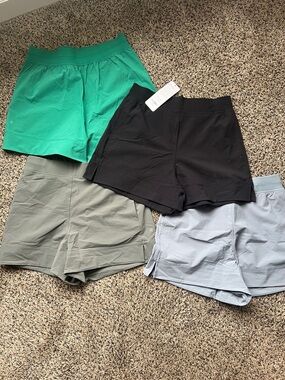 CRZ YOGA Women’s Athletic Shorts Pack - Black, Green, Blue Gray, Olive Gray